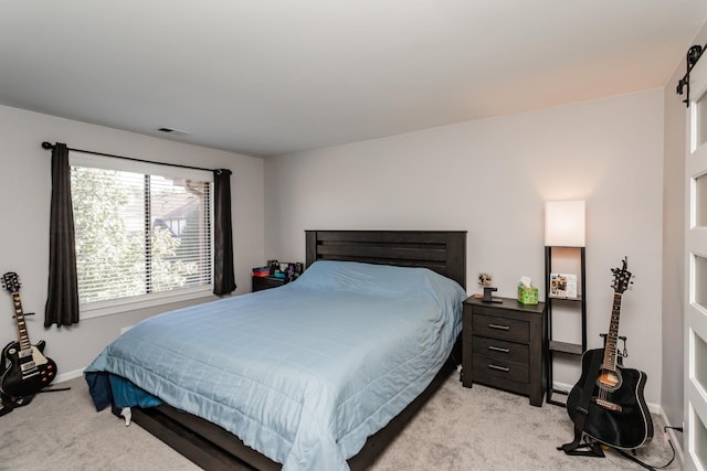 bedroom featuring light colored carpet