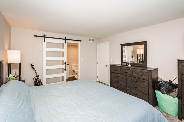 bedroom with a barn door