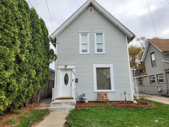 view of property with a front lawn