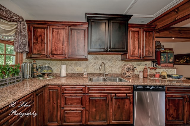 kitchen featuring dishwasher, decorative backsplash, light stone counters, and sink