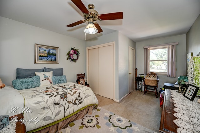 bedroom featuring ceiling fan and light colored carpet