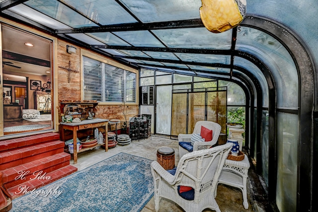 sunroom featuring lofted ceiling