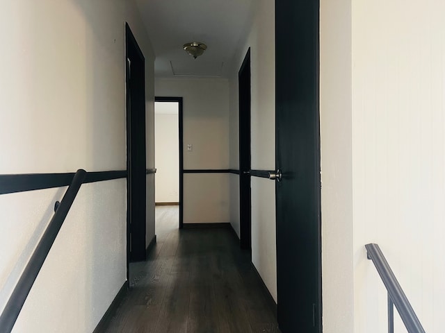 corridor featuring dark hardwood / wood-style flooring