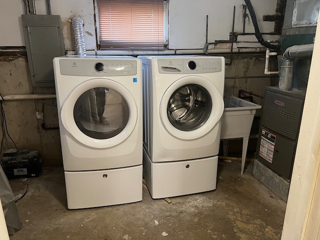 laundry room with washer and clothes dryer and electric panel