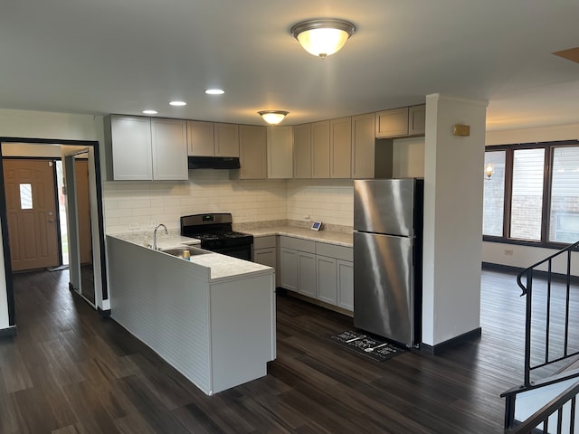 kitchen with stainless steel fridge, gray cabinetry, sink, black gas stove, and dark hardwood / wood-style floors