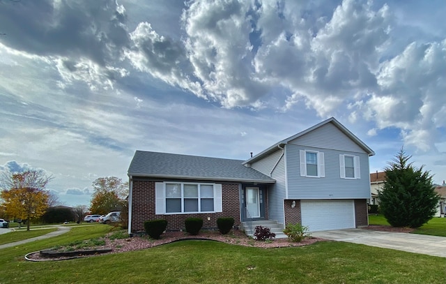 split level home with a front yard and a garage