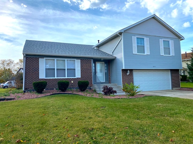 tri-level home featuring a garage and a front lawn