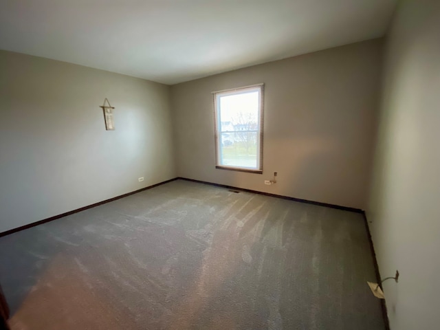 spare room featuring carpet flooring