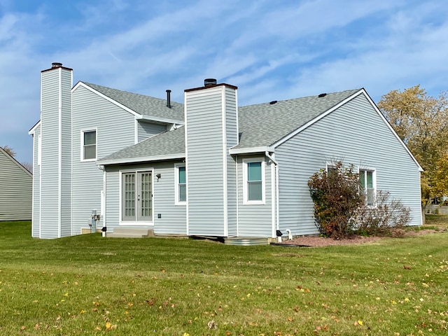 back of house with a yard