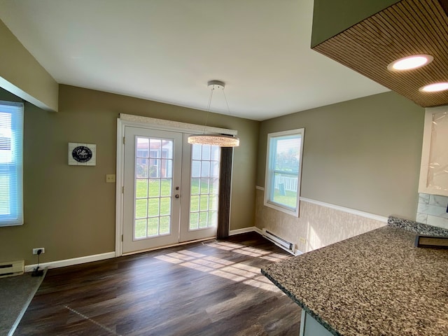 doorway to outside with french doors, dark wood-type flooring, baseboard heating, and a healthy amount of sunlight