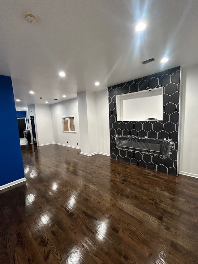 unfurnished living room with hardwood / wood-style floors