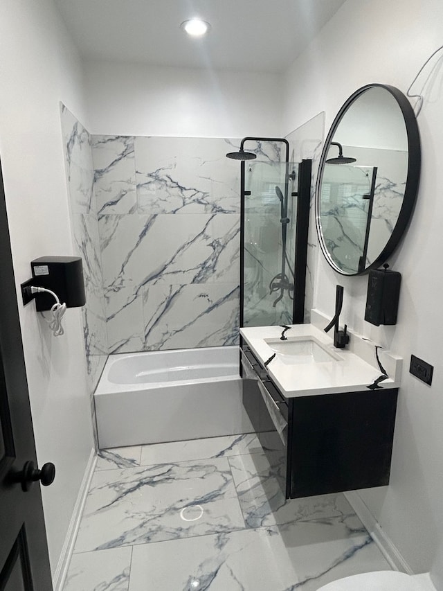 bathroom with vanity and tiled shower / bath combo