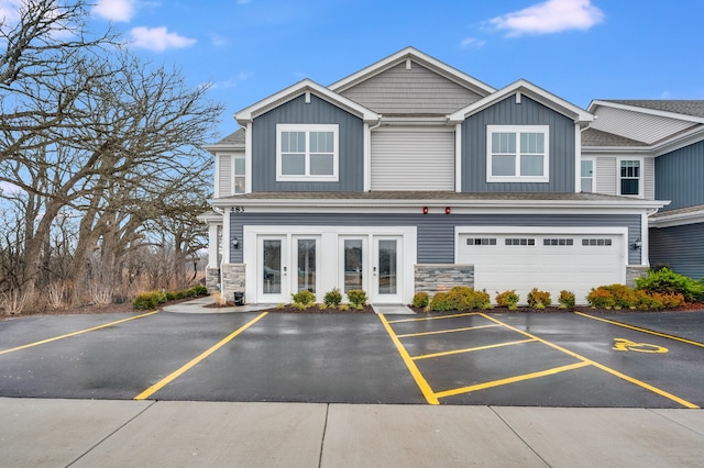 view of front facade featuring french doors and a garage