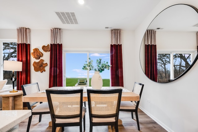 dining area with hardwood / wood-style flooring