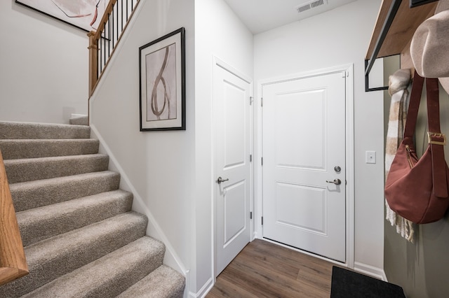 entrance foyer featuring dark hardwood / wood-style floors