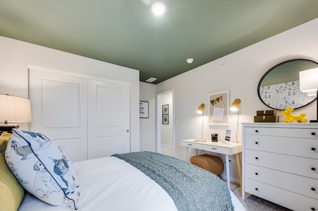 bedroom featuring a closet and carpet