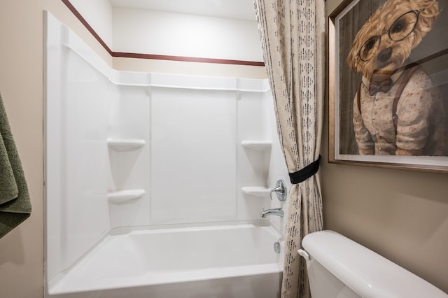 bathroom featuring toilet and shower / bath combo with shower curtain