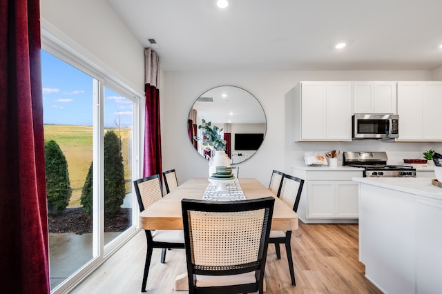 dining room with light wood-type flooring