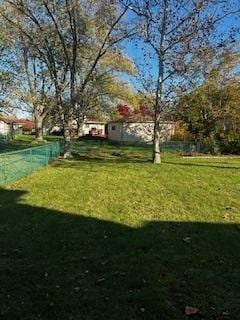 rear view of house with a lawn