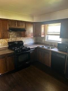 kitchen featuring dark wood-type flooring, ventilation hood, kitchen peninsula, decorative backsplash, and black appliances