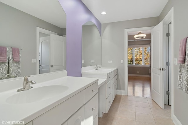 bathroom with tile patterned flooring and vanity