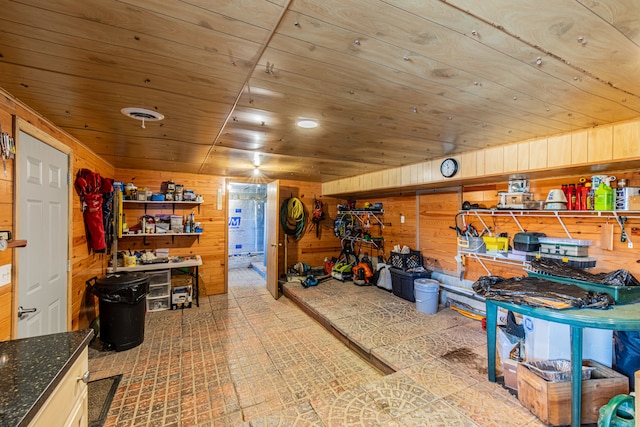 miscellaneous room with wooden ceiling and wood walls