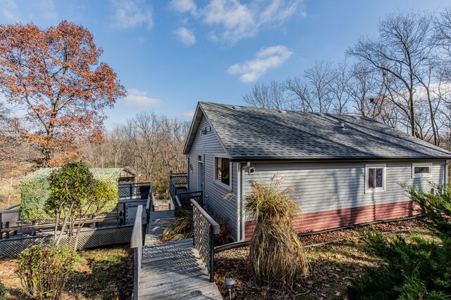 view of property exterior featuring a deck