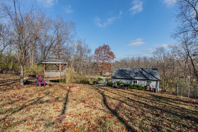 view of yard with a gazebo and an outdoor fire pit