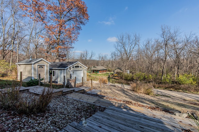 deck featuring a garage and a storage shed