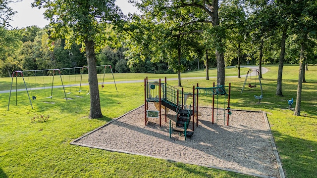 view of jungle gym with a lawn