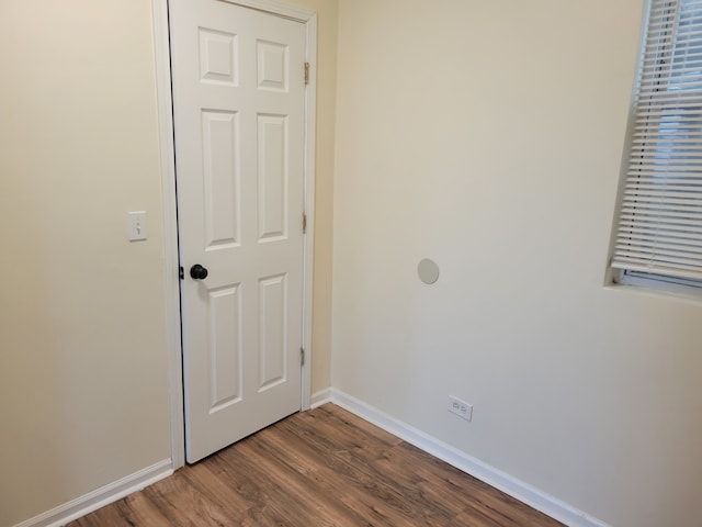 spare room with wood-type flooring