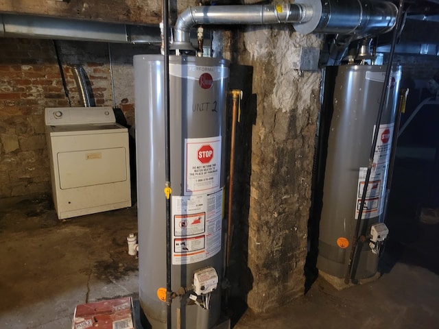 utility room featuring washer / dryer and water heater