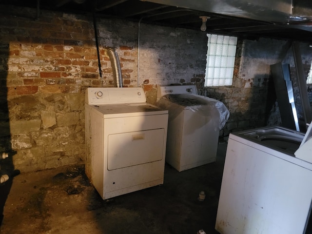 washroom with independent washer and dryer