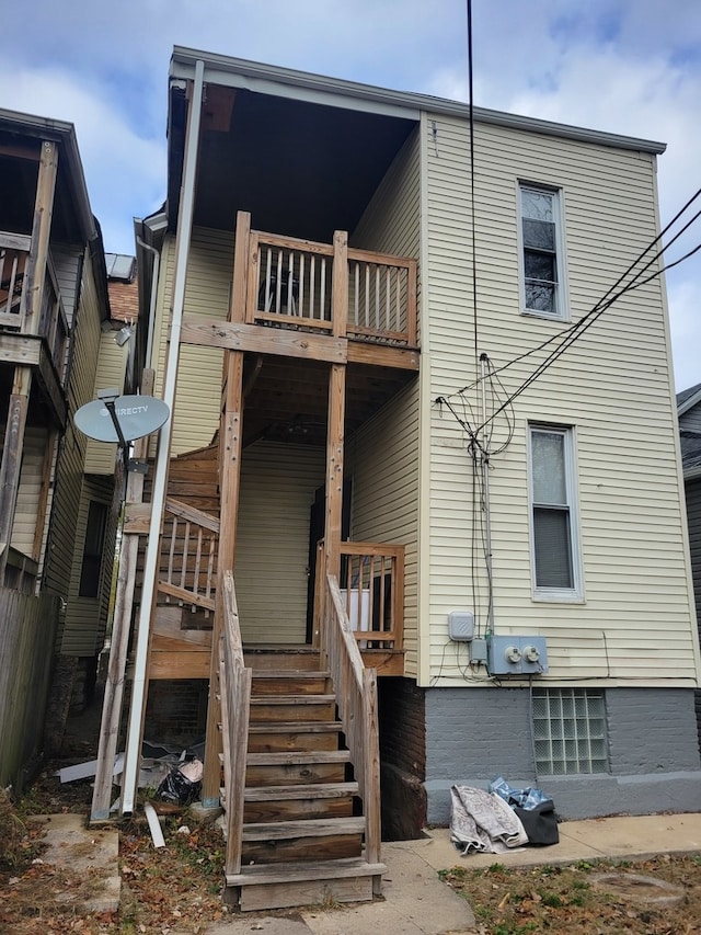 rear view of house with a balcony