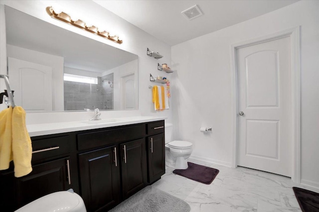 26864 W Wedgewood Ln, Channahon, IL 60410 - bathroom with toilet, marble finish floors, vanity, and a tile shower