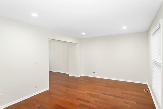 spare room featuring dark hardwood / wood-style floors