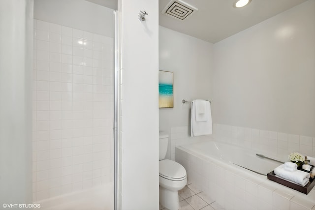 bathroom with toilet, tile patterned floors, and independent shower and bath