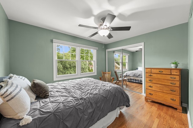 1310 Yorkshire Woods Ct, Wheaton, IL 60189 - bedroom featuring light wood-type flooring, a closet, and ceiling fan
