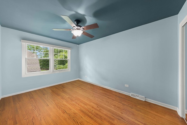 1310 Yorkshire Woods Ct, Wheaton, IL 60189 - unfurnished room featuring a ceiling fan and light wood-style floors