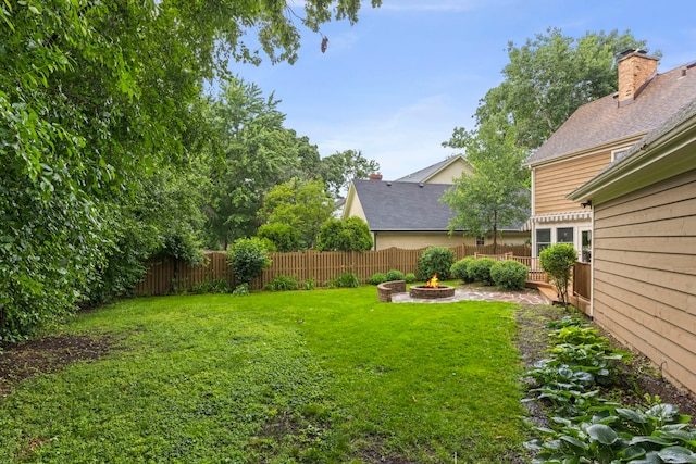 1310 Yorkshire Woods Ct, Wheaton, IL 60189 - fenced backyard featuring an outdoor fire pit