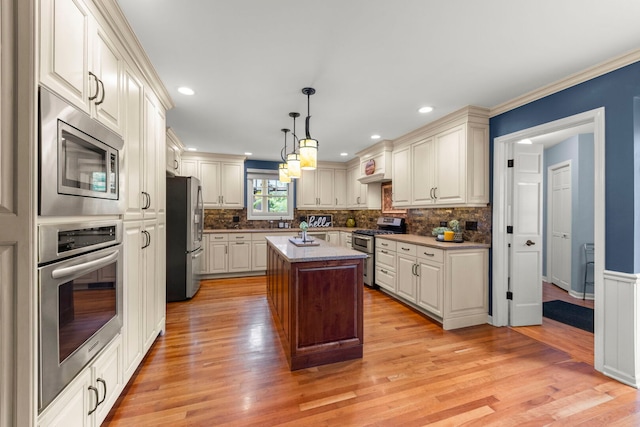 1310 Yorkshire Woods Ct, Wheaton, IL 60189 - kitchen with stainless steel appliances, light wood finished floors, decorative backsplash, a kitchen island, and ornamental molding
