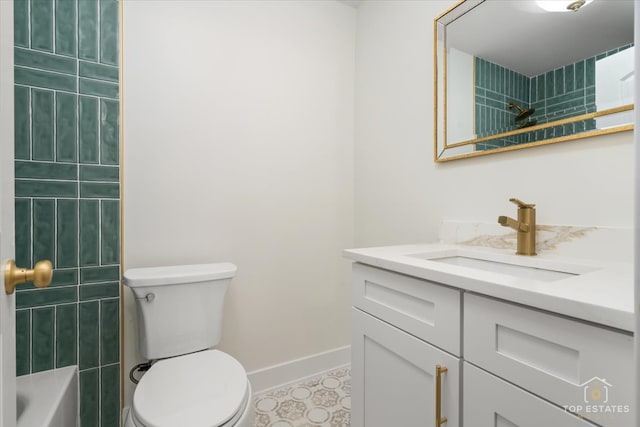 full bathroom with vanity, toilet, and tiled shower / bath