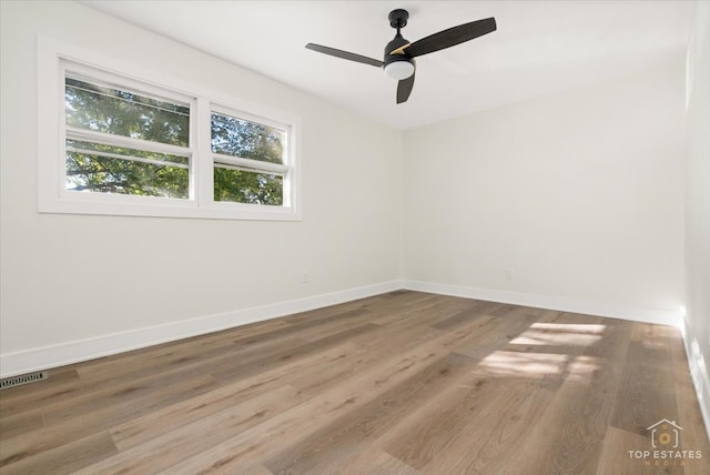 unfurnished room featuring ceiling fan and wood-type flooring