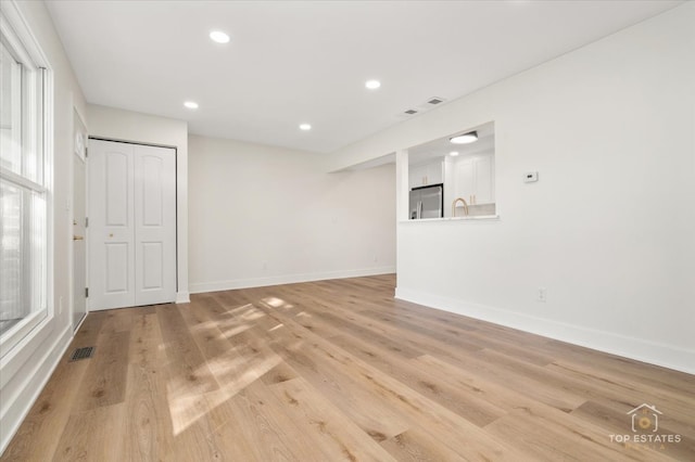 unfurnished room featuring light hardwood / wood-style flooring