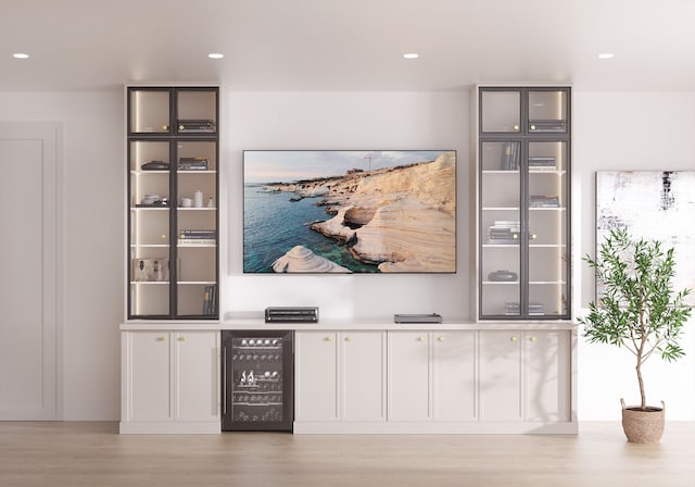 interior space featuring recessed lighting, wine cooler, and wood finished floors