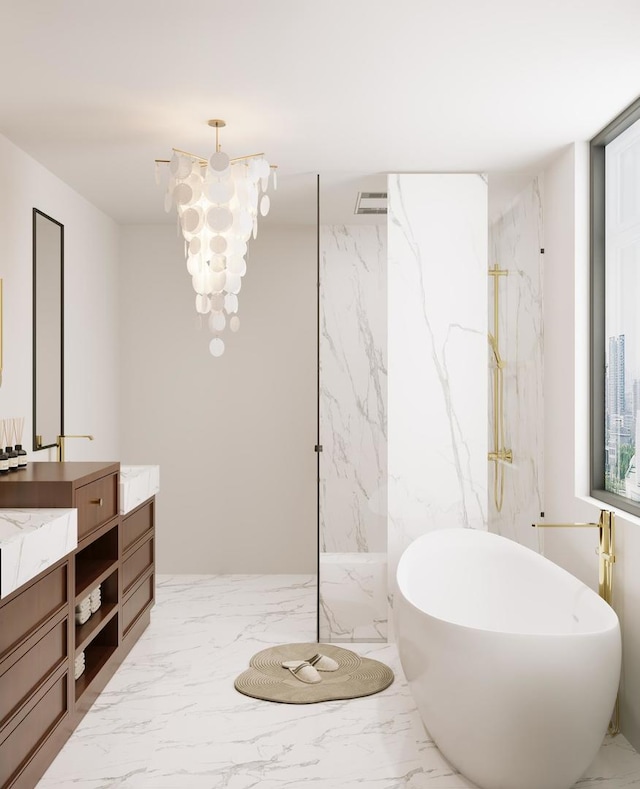 full bath with a notable chandelier, marble finish floor, a marble finish shower, a soaking tub, and vanity