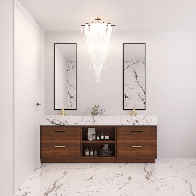 bar with a sink, a notable chandelier, and marble finish floor