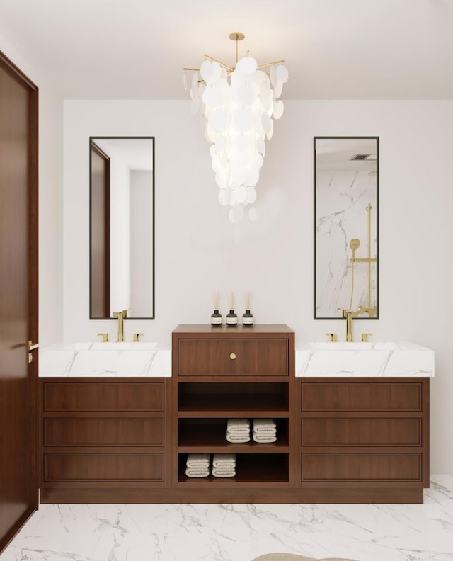 full bathroom with an inviting chandelier, two vanities, marble finish floor, and a sink