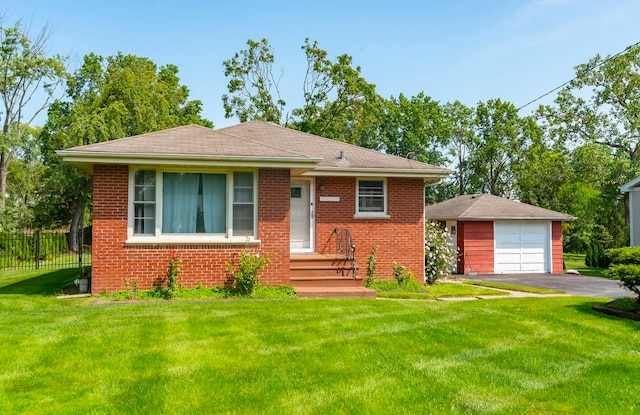 view of front facade with a garage, an outdoor structure, and a front yard