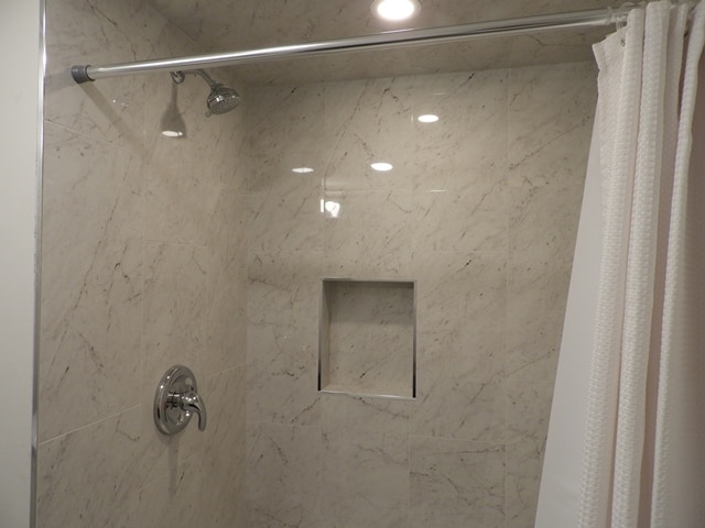 bathroom featuring curtained shower